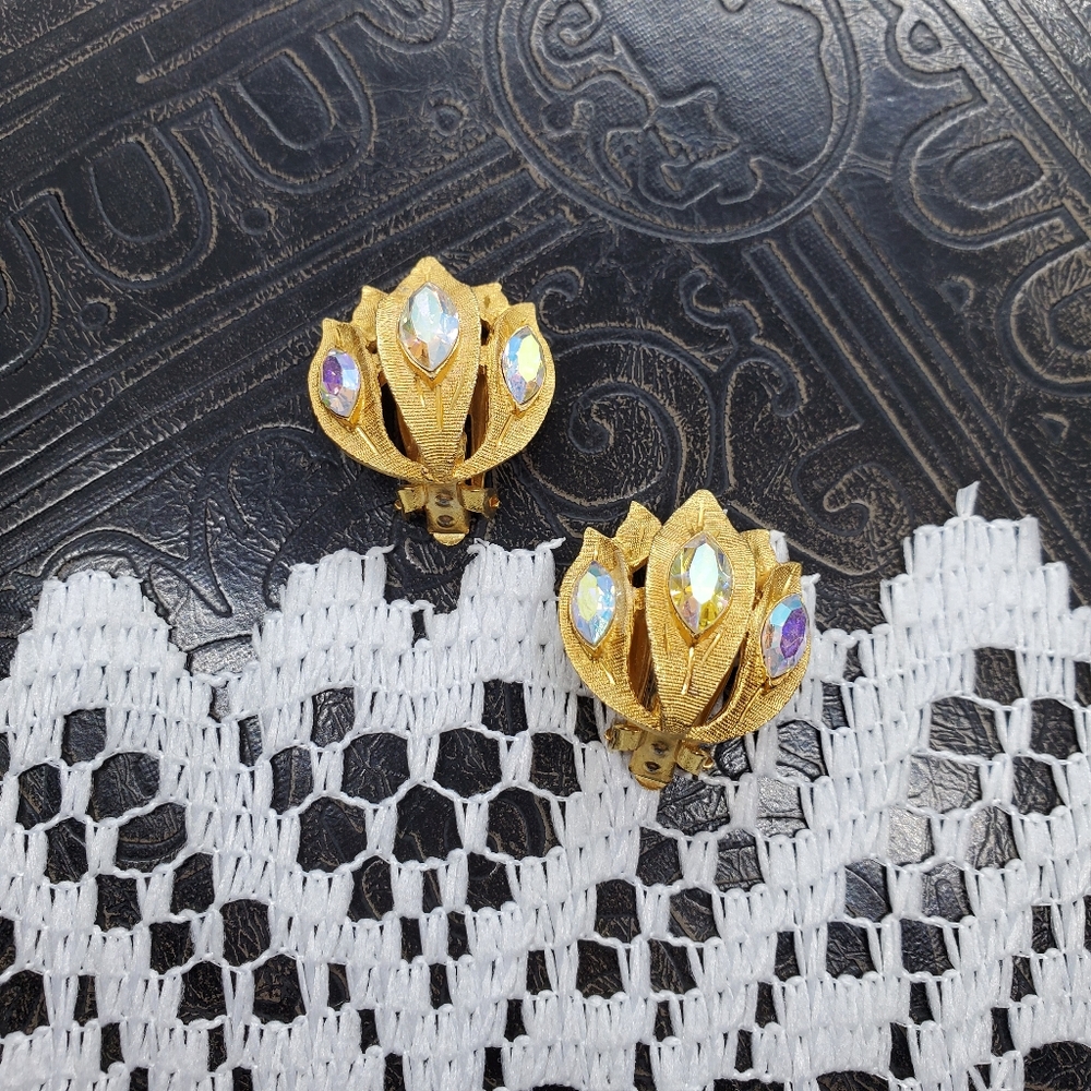 Kramer gold tone and rhinestone lotus earrings.